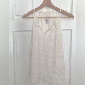 Sleeveless white silk top from Anthropologie